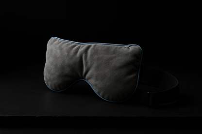 Luxury weighted sleep mask – front view against black background showcasing plush design and premium fabric texture