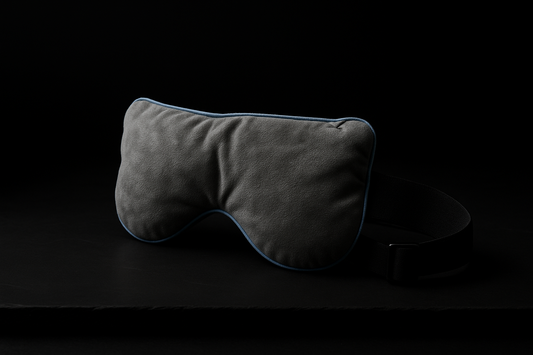 Luxury weighted sleep mask – front view against black background showcasing plush design and premium fabric texture