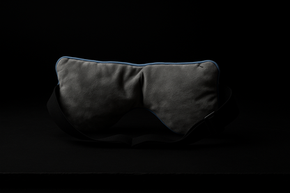 Back view of luxury weighted sleep mask on black background highlighting adjustable strap and ultra-soft inner lining